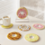 Donut-shaped diatom mud coasters