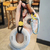 Grip trainer + dumbbell plate stress-relief keychain pendant