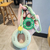 Grip trainer + dumbbell plate stress-relief keychain pendant