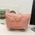 Expandable wheeled travel bag with retractable handle