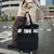 Expandable wheeled travel bag with retractable handle